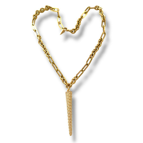 Gold chain necklace with a tassel pendant on a white background