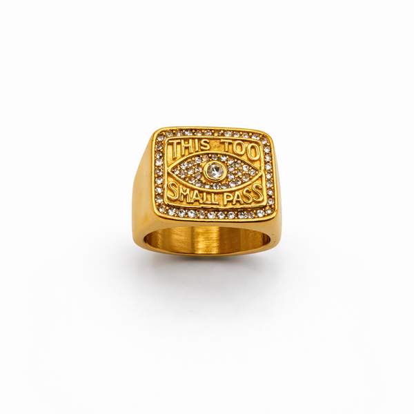 Gold ring with engraved text on a white background