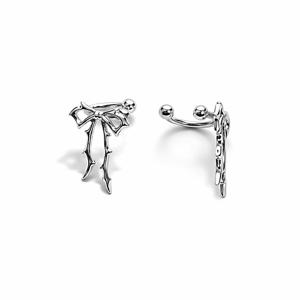 Silver bow-shaped earrings on a white background