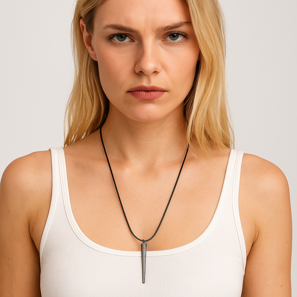 Woman wearing a necklace with a plain background. The Benson Necklace by Jagged Halo Jeewelry