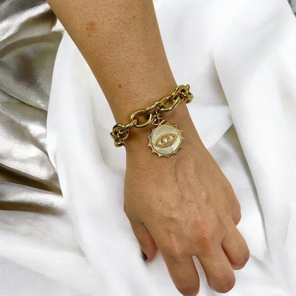 model wearing the tatiana evil eye bracelet with white silk background