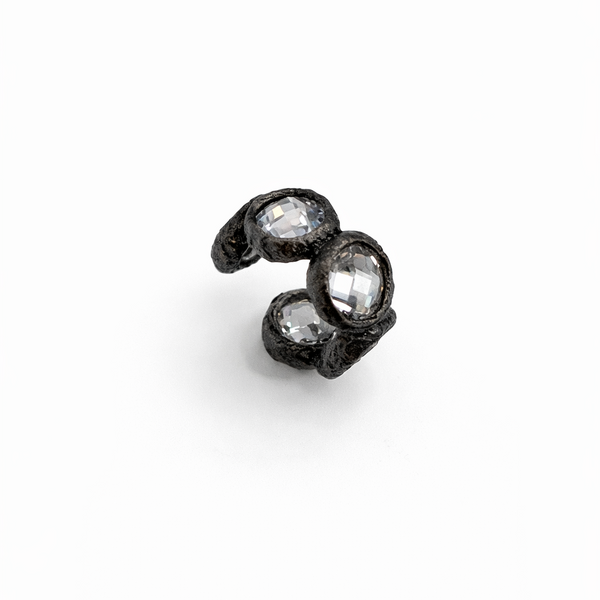 Black stone earring on a white background