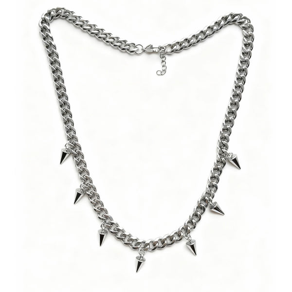 Silver chain necklace with spike decorations on a white background