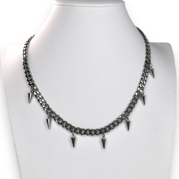 A gold-colored stainless steel curb chain necklace with spikes every few links, featuring a lobster claw clasp.