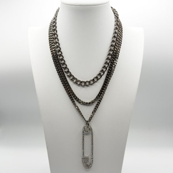 Necklace with chain design on a mannequin bust against a white background