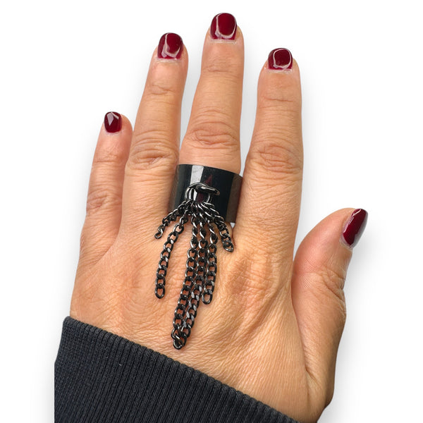 model wearing tassel ring jagged halo jewelry pained nails color malaga wine by opi