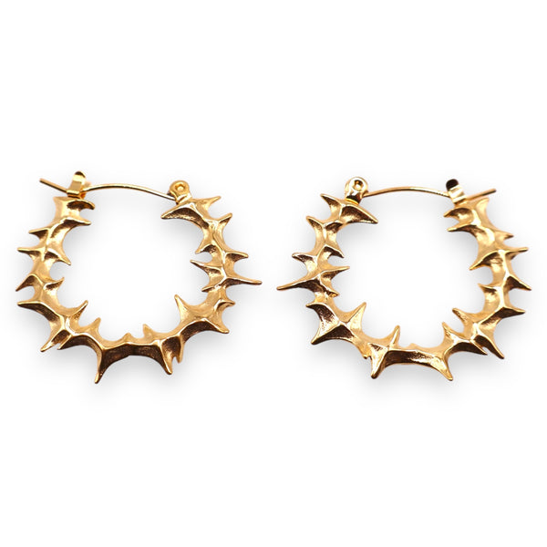 A pair of gold-colored Yennefer spike hoop earrings with an organic edgy spiked outer layer on a white background.