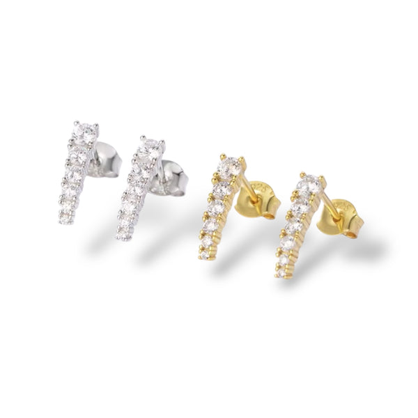 spike diamond stud earrings in both yellow gold and white gold against white background
