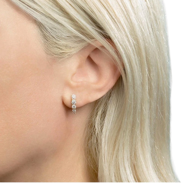 blonde model wearing spike diamond stud earrings jagged halo jewelry