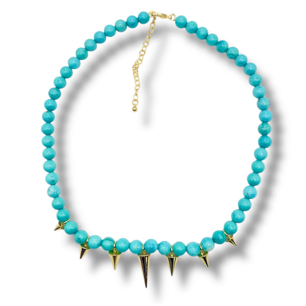 Turquoise spike necklace on white background
