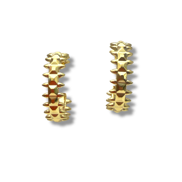 Gold spike earrings on a white background