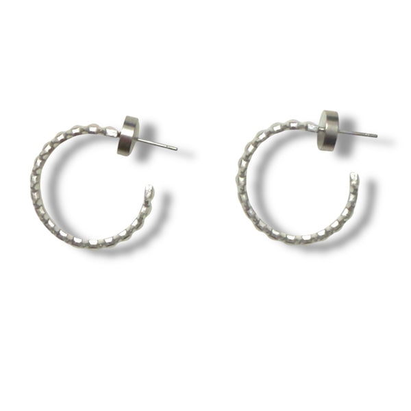 Pair of silver hoop earrings on a white background