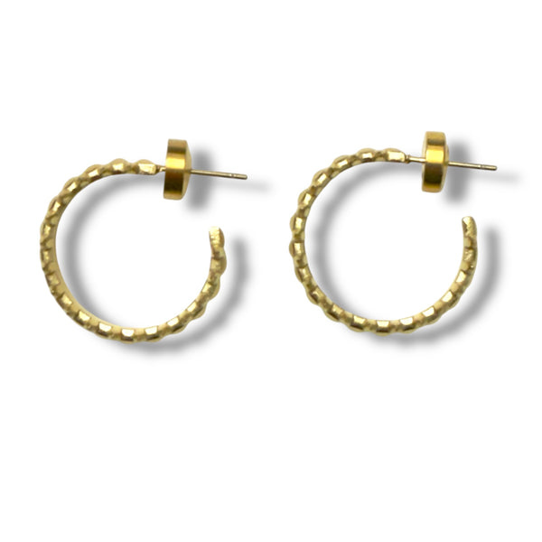 Gold hoop earrings on a white background