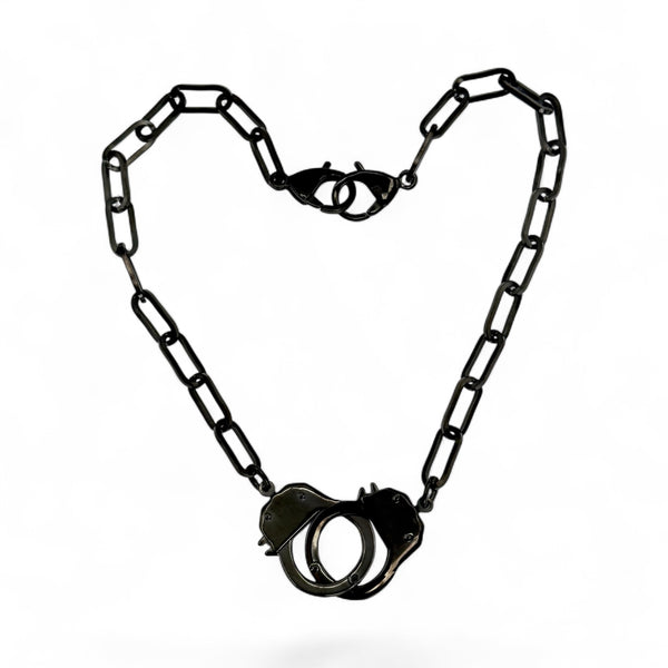 black handcuff jewelry necklace on white bakground