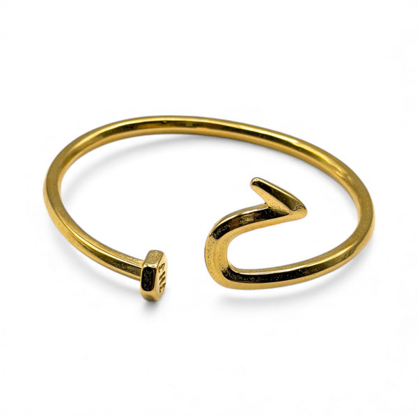 Gold nail bracelet on a white background