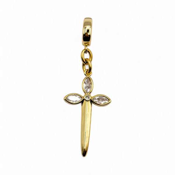 Gold cross-shaped pendant with embedded stones on a white background