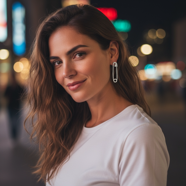 Woman wearing a white top with a blurred city street background by jagged halo jewelry