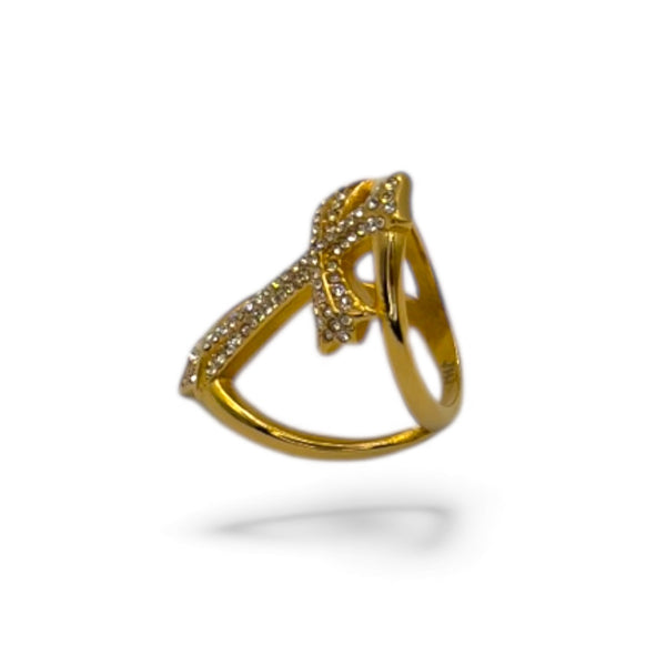 Gold ring with diamond accents on a white background by jagged halo jewelry