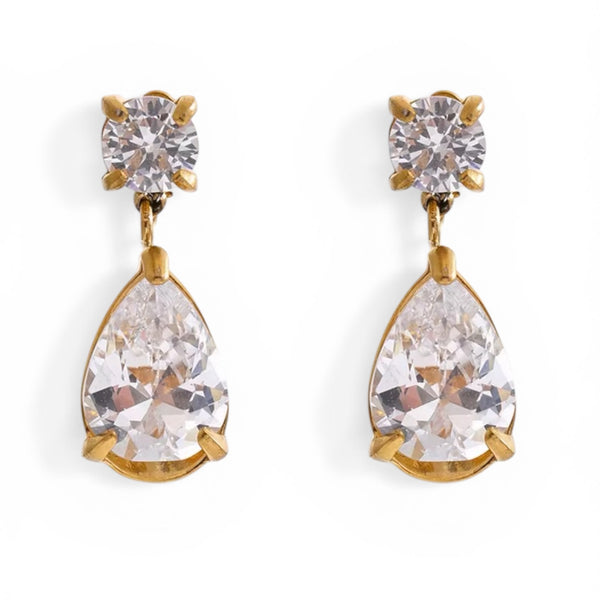 Gold earrings with clear teardrop-shaped gemstones on a white background