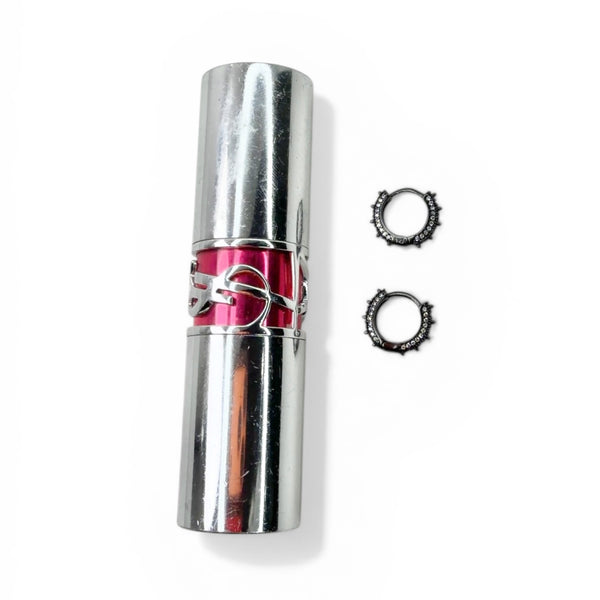 Silver cylindrical container with pink top and two black rings on a white background