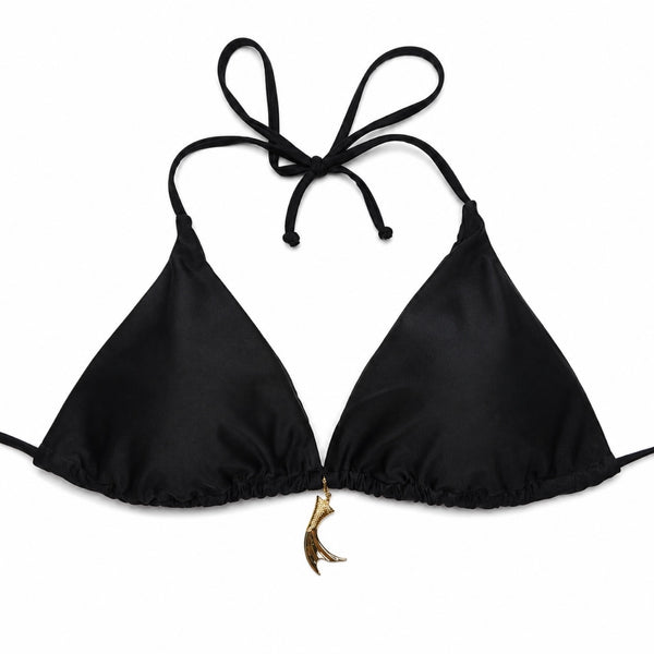 Black bikini top with tie straps and a gold charm on a white background