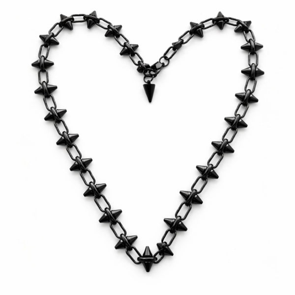 hematite plated stainless steel barbie chain necklace with star-shaped spikes forming a heart shape on a white background by jagged halo jewelry