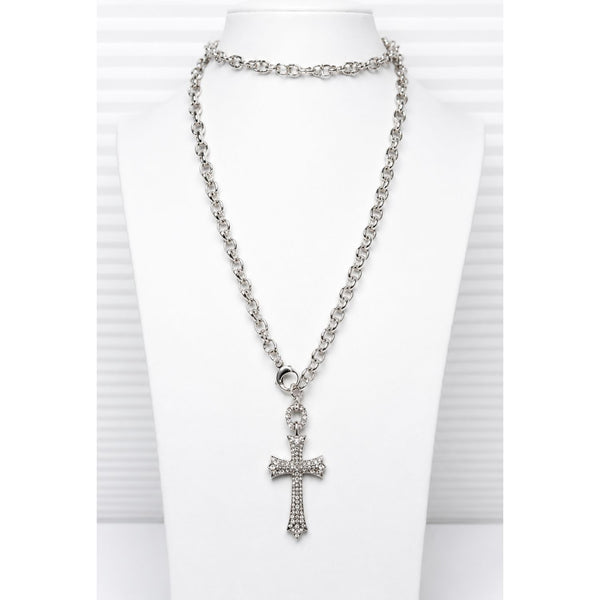 long cross necklace on a silver stainless steel chain on a white neck form