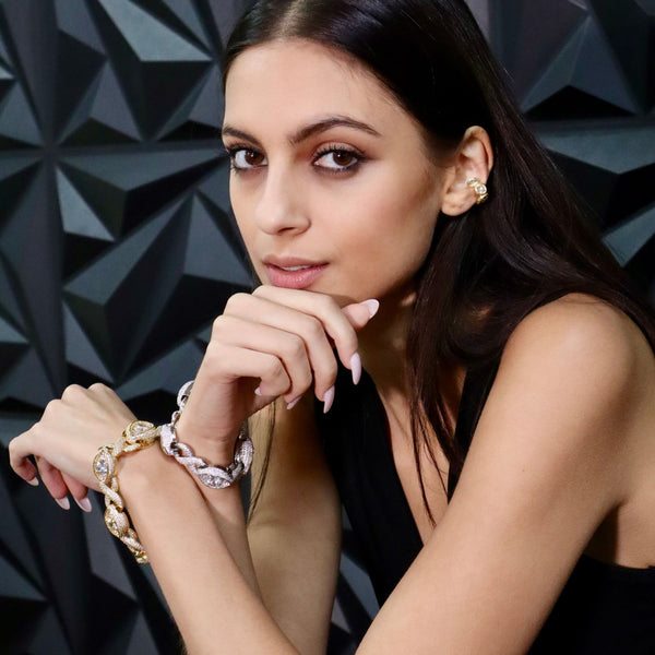 Model wearing the Xo sterling silver ear cuff in white gold by jagged halo jewelry