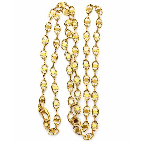 Gold chain necklace on a white background