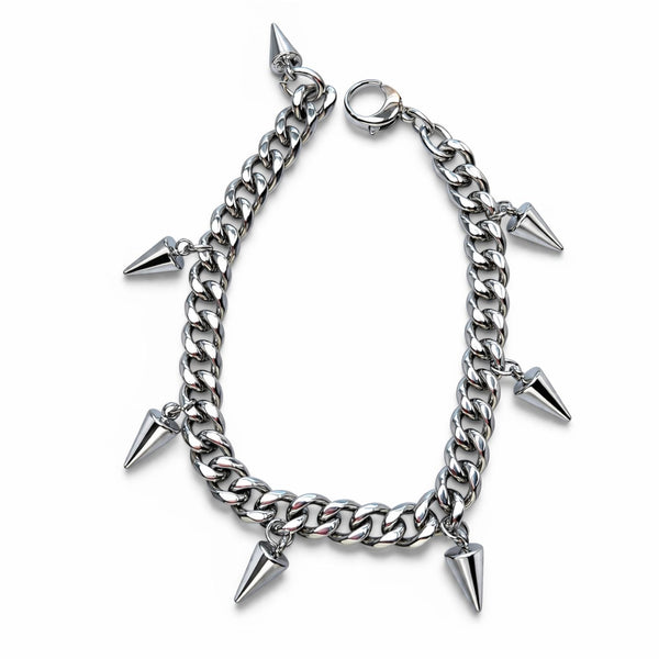 Silver chain bracelet with spike charms on a white background