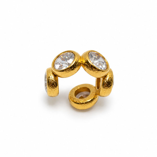 Reign Crystal Ear Cuff with five clear crystals in textured yellow gold plated stainless steel settings.