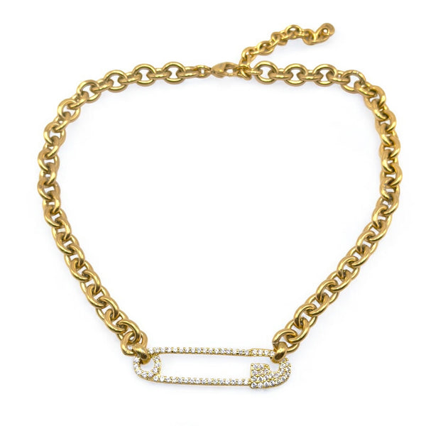 gold safety pin necklace on white background