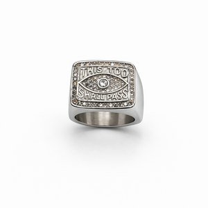 Silver ring with engraved text on a white background