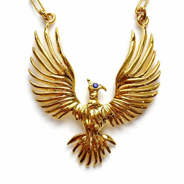 Gold eagle pendant necklace on a white background