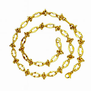 Gold chain necklace on a white background