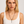 Woman wearing a necklace with a plain background. The Benson Necklace by Jagged Halo Jeewelry 