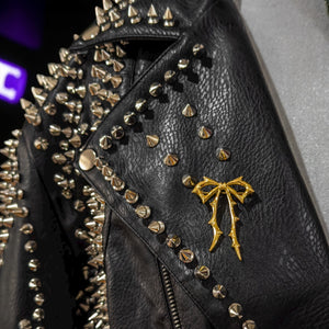 Carrie now brooch on a black leather jacket by jagged halo jewelry 