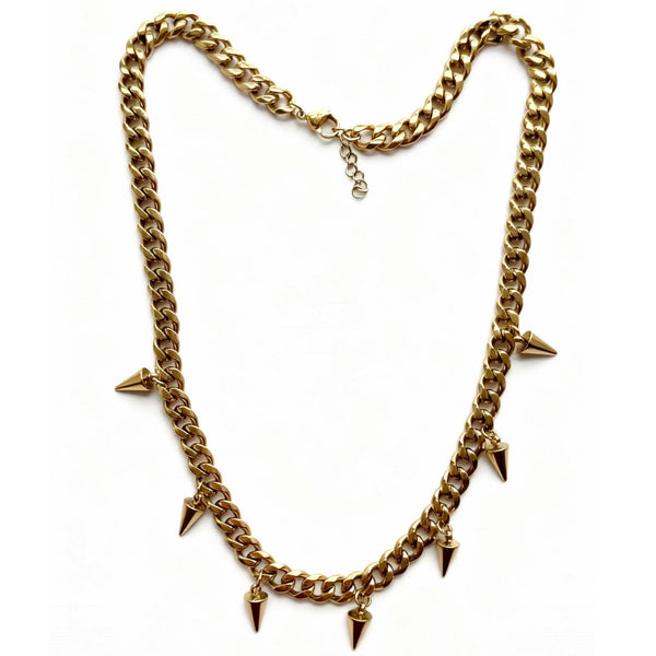 Gold chain necklace with spike pendants on a white background