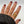 black jackard sleeve model wth burgandy nail polish wearing the jagged halo viper snake ring