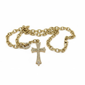 Gold chain Necklace with a cross pendant on a white background saints necklace by jagged halo jewelry