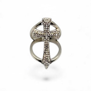 Silver cross-shaped ring with gemstones on a white background by jagged halo jewelry
