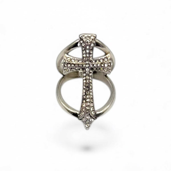 Silver cross-shaped ring with gemstones on a white background by jagged halo jewelry