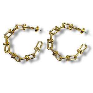 Gold chain-style hoop earrings on a white background