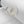 Gold hoop earrings on a white surface
