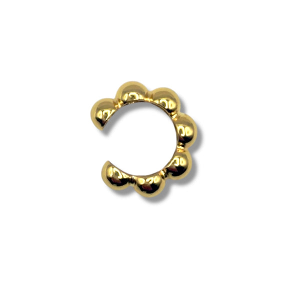Gold nose ring on a white background