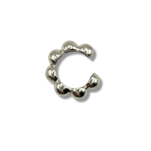Silver septum ring on a white background