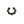 Black metal horseshoe charm on a white background