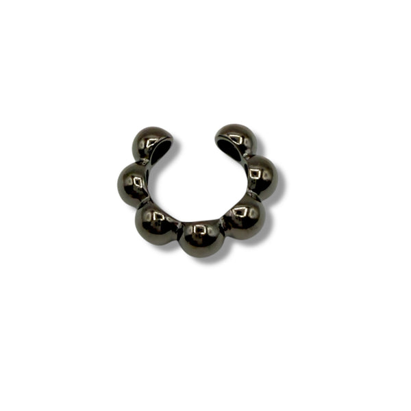 Black metal horseshoe charm on a white background