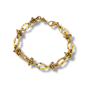 Gold chain bracelet on a white background