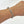 Silver chain bracelet on a wrist against a white background